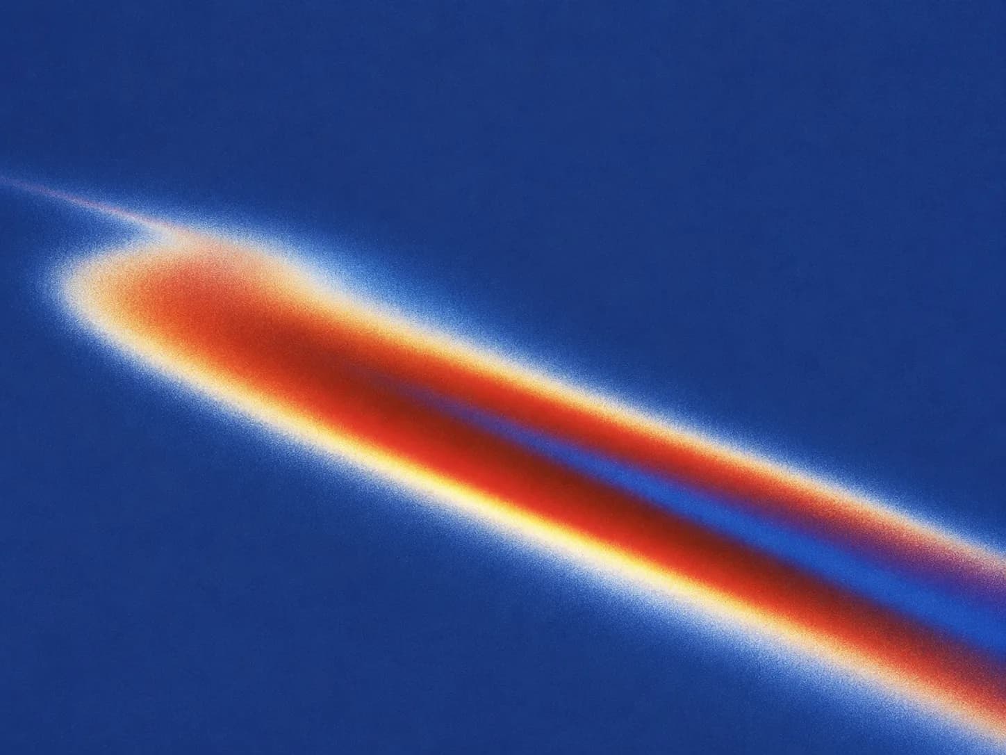 A prismatic beam burning across a deep blue field