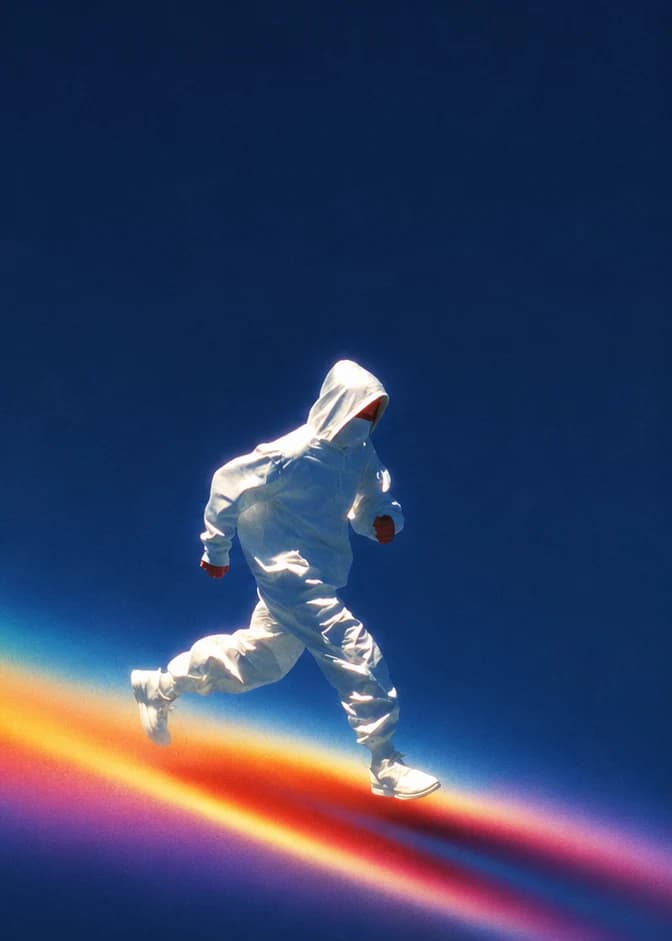 A runner in white ascending a prismatic beam of light